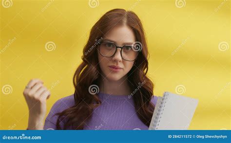 Medium Shot Of Flirting Cute Brunette In Big Glasses Holding Spring Notebook Stock Footage