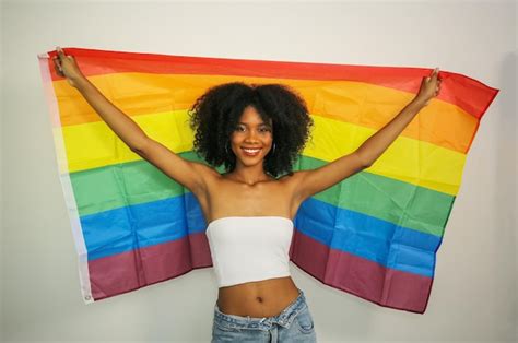 Premium Photo Smiling African Woman Holding Rainbow Lgbt Flag