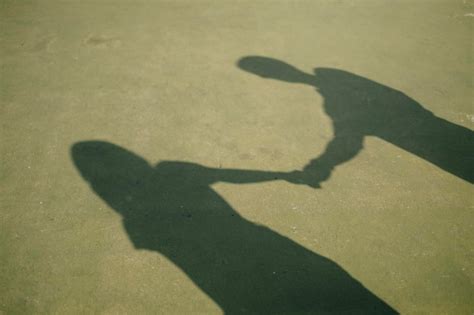 Premium Photo | Shadow of couple holding hands