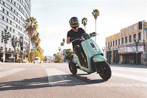 Three-wheel electric seated scooter aimed at urban riders and delivery ...