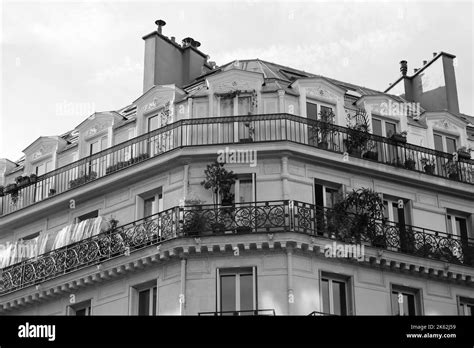 Classic Parisian Architecture Building Facade With Mansard Roof