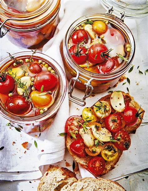 Three Jars Filled With Different Types Of Food On Top Of A Table Next