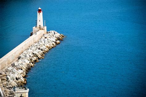 Free Images Sea Coast Ocean Lighthouse Reflection Vehicle Tower