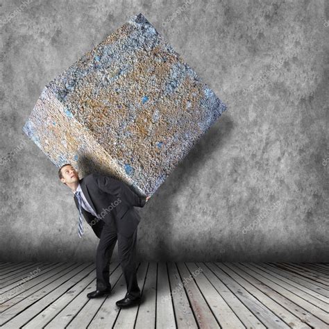 Businessman carrying heavy stone package — Stock Photo © semisatch ...