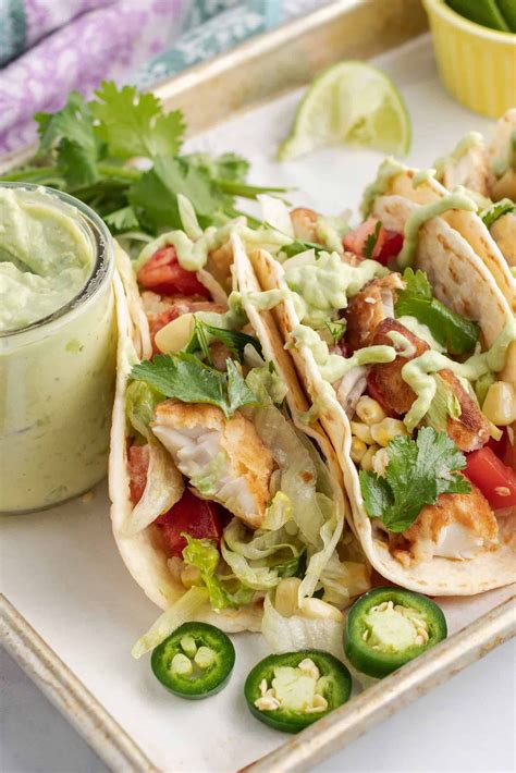 Fish Tacos With Avocado Sauce Avocado Sauce Seafood Recipes Seafood