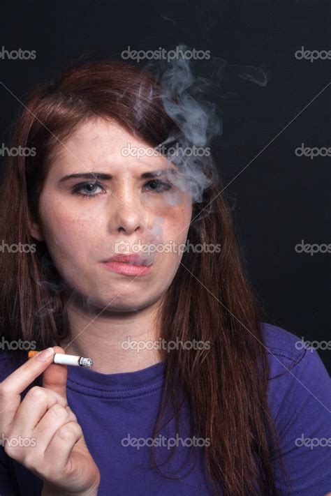 Beautiful Brunette Smokes A Cigarette Stock Photo Csproductions