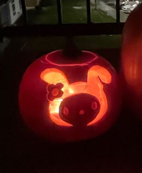 two pumpkins that have been carved to look like mickey mouse and pluto ...