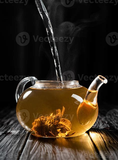 Hot Water Pouring Into The Glass Teapot With Chinese Tea 4465095 Stock Photo At Vecteezy