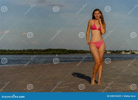 Lovely Blonde Bikini Model Posing Outdoors On A Caribbean Beach Stock