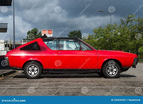 Profile View Of Red Renault Parked In The Street Editorial Stock