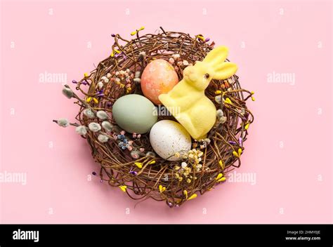 Nest With Painted Easter Eggs Bunny And Pussy Willow Branches On Pink