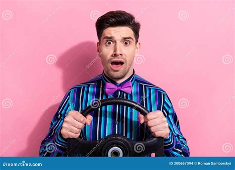 Photo Of Speechless Impressed Guy Arms Hold Wheel Open Mouth Unbelievable Isolated On Pink Color