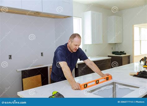 Leveling with Countertops of Making a Modern Domestic Kitchen Cabinets Stock Photo - Image of ...