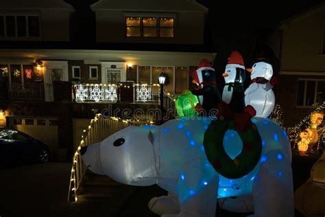 Christmas Decorations Glowing Outside at Night in Front of a House ...