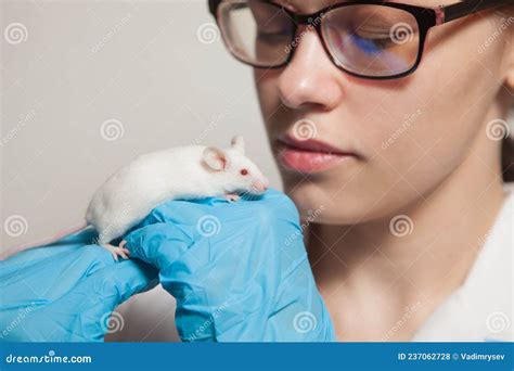 Scientist In Blue Shirt And Lab Coat Do Experiments In A Scientific