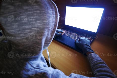 Hacker Hand Stealing Data From Laptop Top Down Stock Photo At