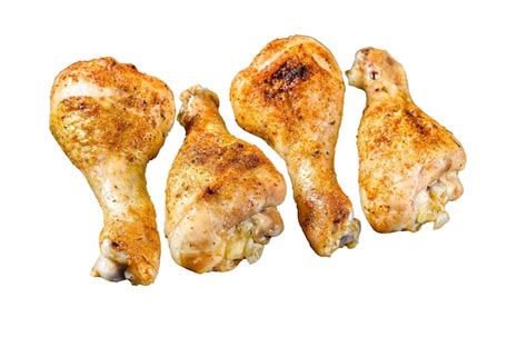 Cuisses de pilon de poulet au four aux herbes isolé sur fond blanc