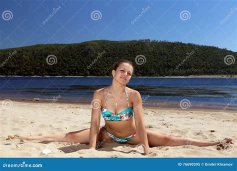 Girl In Bathing Suit Sitting On Splits Sunny Beach Stock Image Image