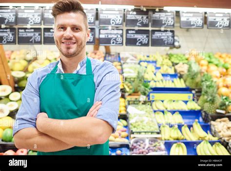 Portrait Of Sales Clerk In Grocery Store Stock Photo Alamy