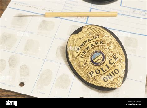 Finger Prints On Blotter With Police Investigators Badge Crime Courts