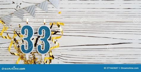 Number 33 Blue Celebration Candle On White Wooden Background Happy