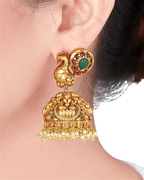 Golden and emerald green peacock jhumka with pearls by Joules By ...