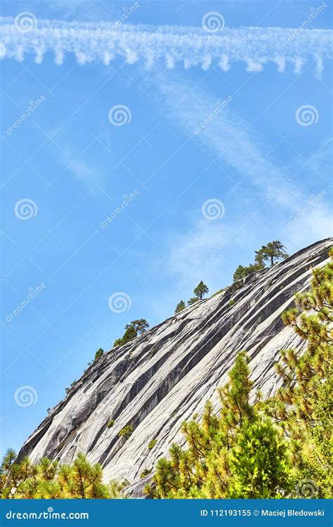 Scenic Cliff With Condensation Trails On The Sky Stock Image Image