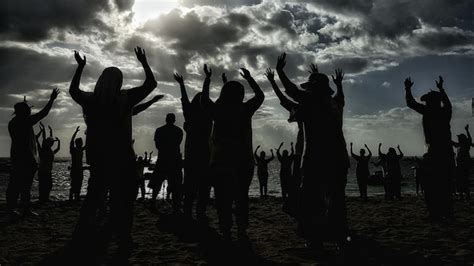 Premium Photo Silhouette People With Arms Raised Standing At Beach