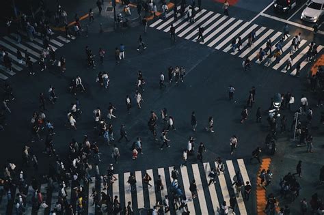 Premium Photo High Angle View Of People Walking On Road