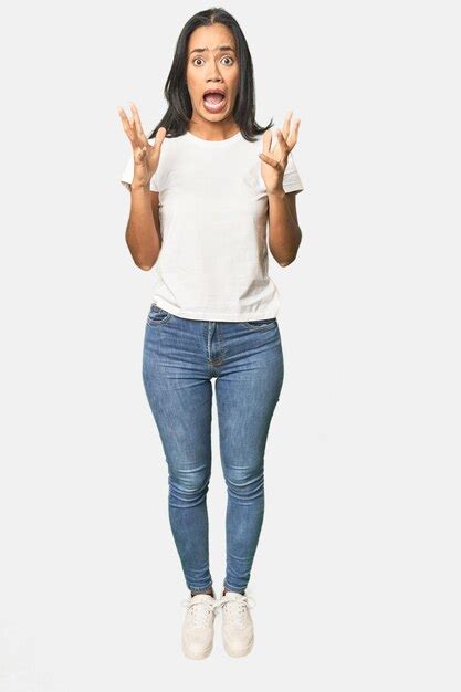 Premium Photo Full Body Shot Of Latina In Studio Screaming To The Sky Looking Up Frustrated