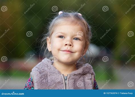 Portrait Of The Proud Little Girl Looking Aside Stock Photo Image Of