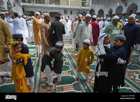 Muslims Hug And Greet Each Other After Offering Eid Al Fitr Prayers At