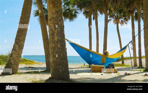 Romantic Couple Relaxing In Tropical Hammock Stock Photo Alamy