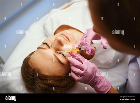 Injections of blood plasma in the face and head Stock Photo - Alamy