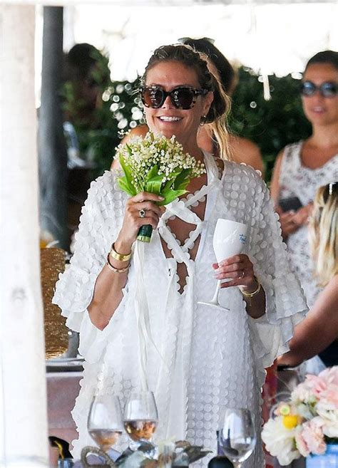 Heidi Klum's wedding latest: bouquet throwing and official pic!