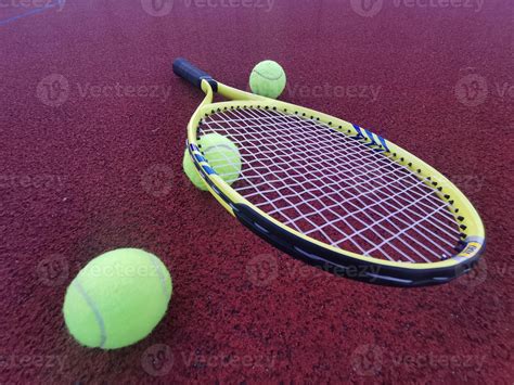 Tennis racket and ball on a hard tennis court 40549406 Stock Photo at ...