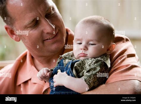 Father Holding His Baby Stock Photo Alamy