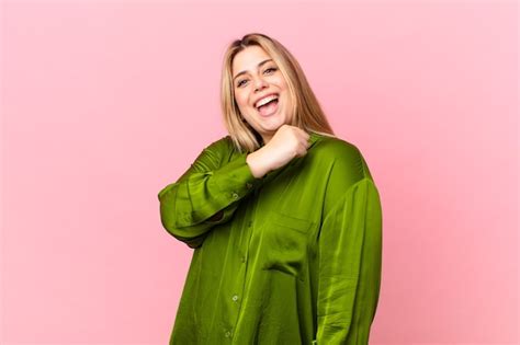 Premium Photo Curvy Pretty Blonde Woman Feeling Happy And Facing A Challenge Or Celebrating