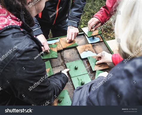 Adults Putting Together Pieces Outdoor Wooden Stock Photo