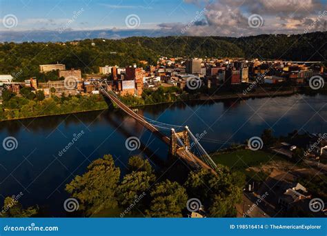 aerial  historic wheeling suspension bridge downtown buildings