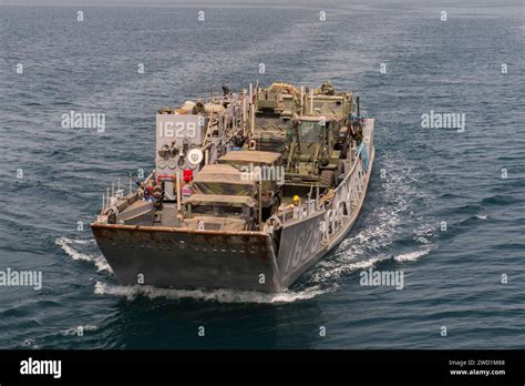 Landing Craft Utility Boat Prepares To Enter The Well Deck Of USS