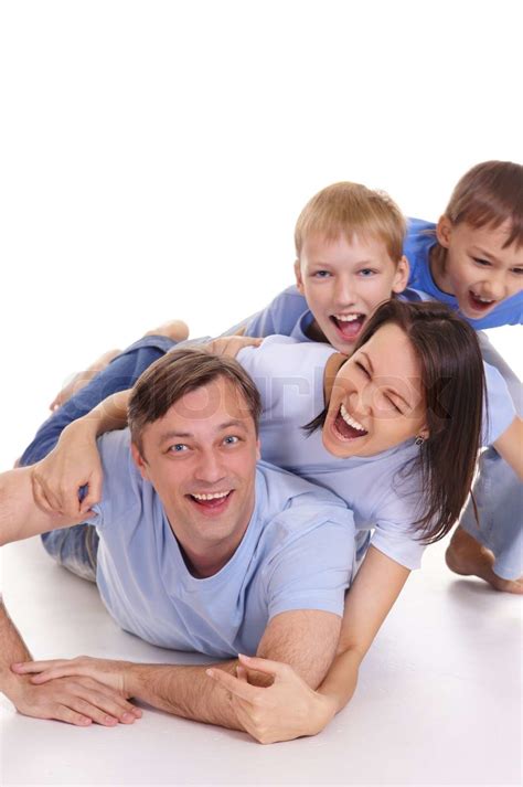 lykkelig familie liggende på hvidt Stock foto Colourbox