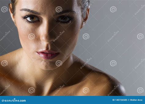 A Lovely Brunette Model Poses In A Studio Environment Stock Image