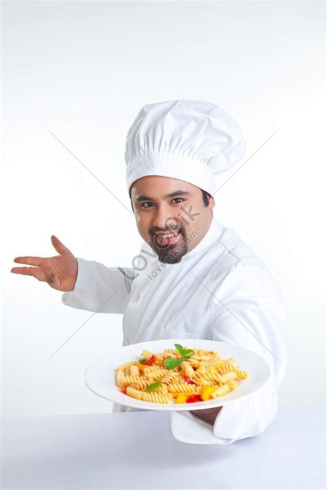 Portrait Of Chef Holding Plate Of Pasta Picture And HD Photos Free