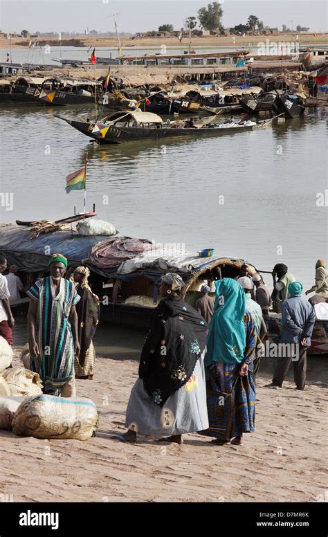 Local Men And Women Waiting To Buy Fish From Fishing Boats Early