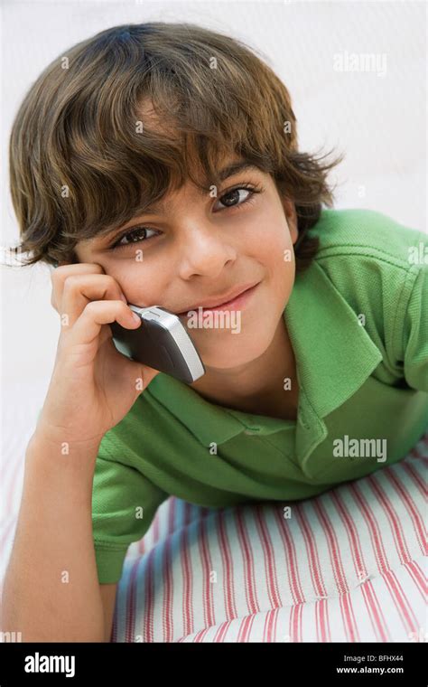 Young Boy Using Cell Phone Stock Photo Alamy