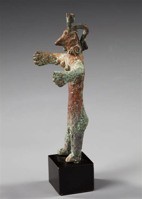 A CANAANITE BRONZE FEMALE FIGURE, CIRCA EARLY 2ND MILLENIUM B.C.