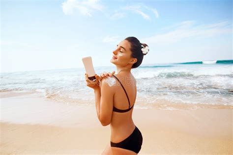 Woman Applying Sunscreen Creme On Tanned Shoulder Skincare Body Sun