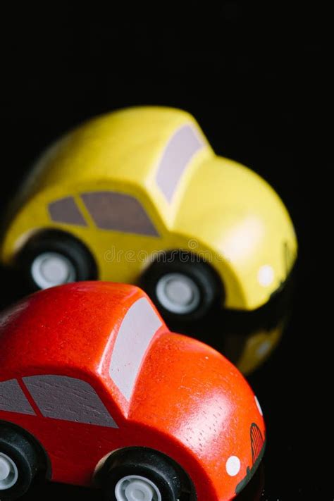 Red and Yellow Tiny Toy Cars on a Black Background Stock Image - Image ...