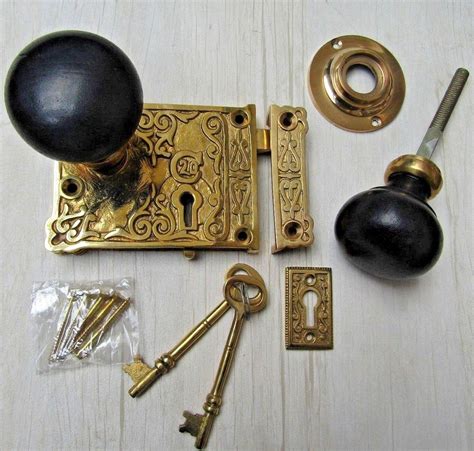 Ornate Rim Lock Plain Bun Ebony Brass Set Ironmongery World